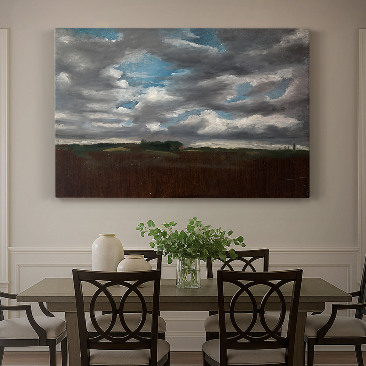 Canvas art print featuring a wide landscape beneath heavy grey clouds, showcased as a statement wall artwork