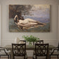 Canvas art print featuring a reclining female figure near shoreline with calm water behind, showcased as a statement wall artwork