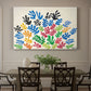 Canvas art print featuring an abstract arrangement of colorful leaf-like cut-outs, showcased as a statement wall artwork