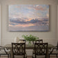 Canvas art print featuring a sky filled with warm sunset clouds over low horizon, showcased as a statement wall artwork