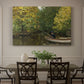 Canvas art print featuring a young boy fishing beside calm water surrounded by greenery, showcased as a statement wall artwork