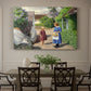 Canvas art print featuring people walking along village path beside houses in bright summer light, showcased as a statement wall artwork