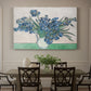 Canvas art print featuring a cluster of irises blooming with flowing brushstrokes and vivid color, showcased as a statement wall artwork