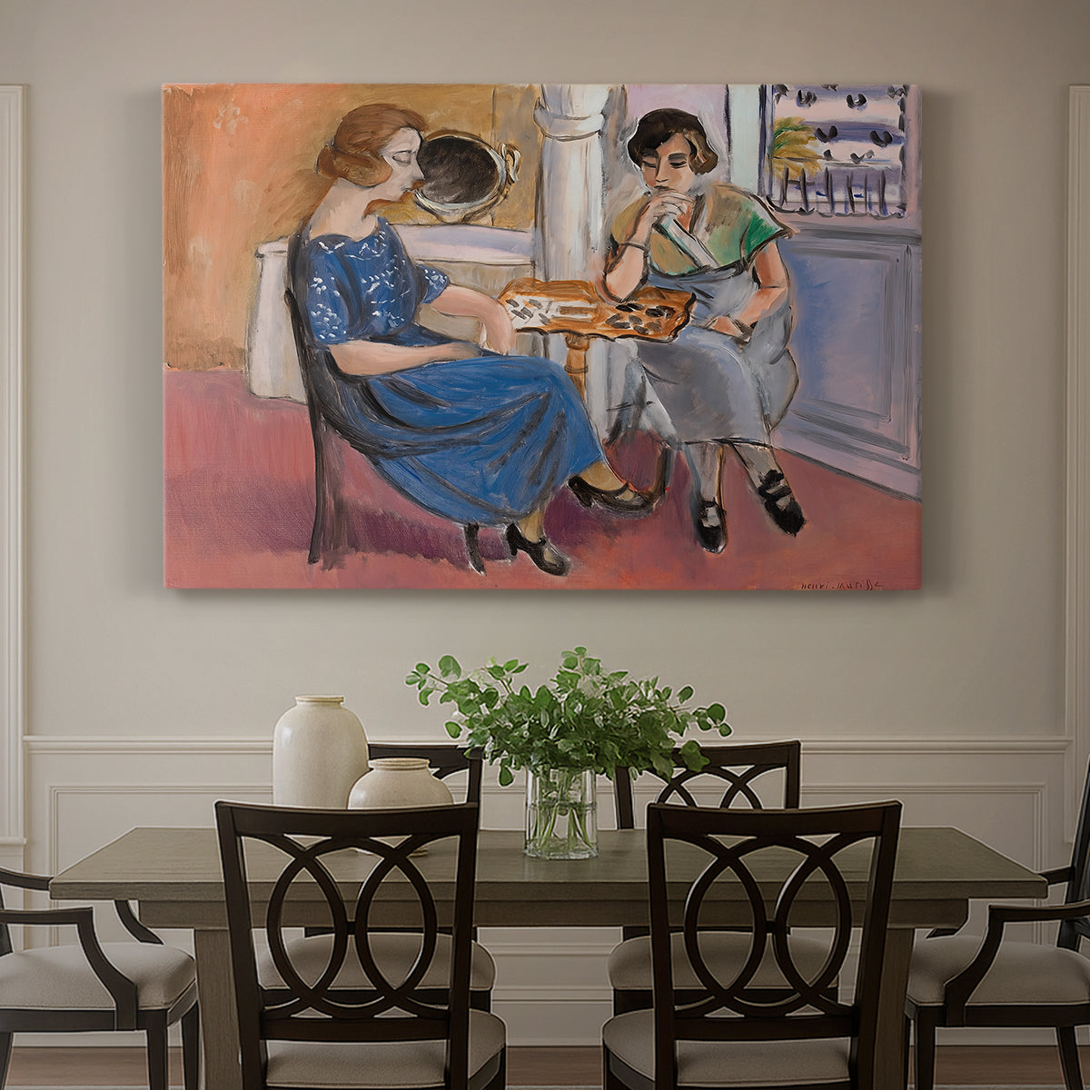 Canvas art print featuring two figures seated at a table playing dominoes in a colorful interior, showcased as a statement wall artwork