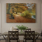Canvas art print featuring figures walking along forest path covered in autumn leaves, showcased as a statement wall artwork
