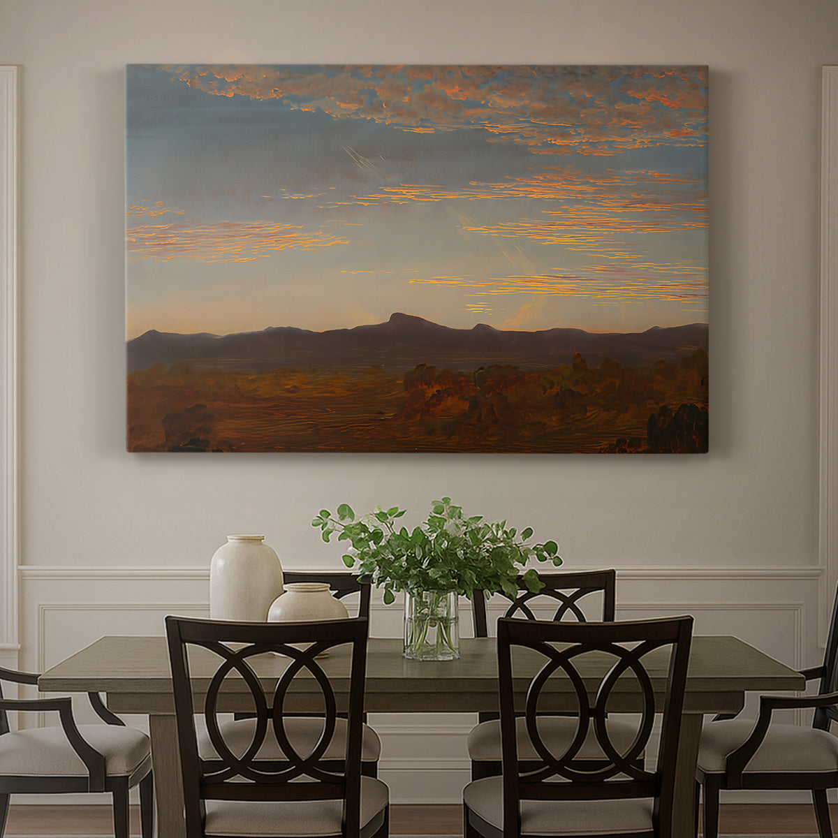 Canvas art print featuring a low mountain landscape under warm sky with broad open foreground, showcased as a statement wall artwork