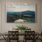 Canvas art print featuring a figure standing in small boat on open water with distant hills behind, showcased as a statement wall artwork