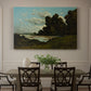Canvas art print featuring a wide river landscape with distant town and boats under open sky, showcased as a statement wall artwork
