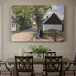 Canvas art print featuring a woman and milkman standing along village street with houses nearby, showcased as a statement wall artwork