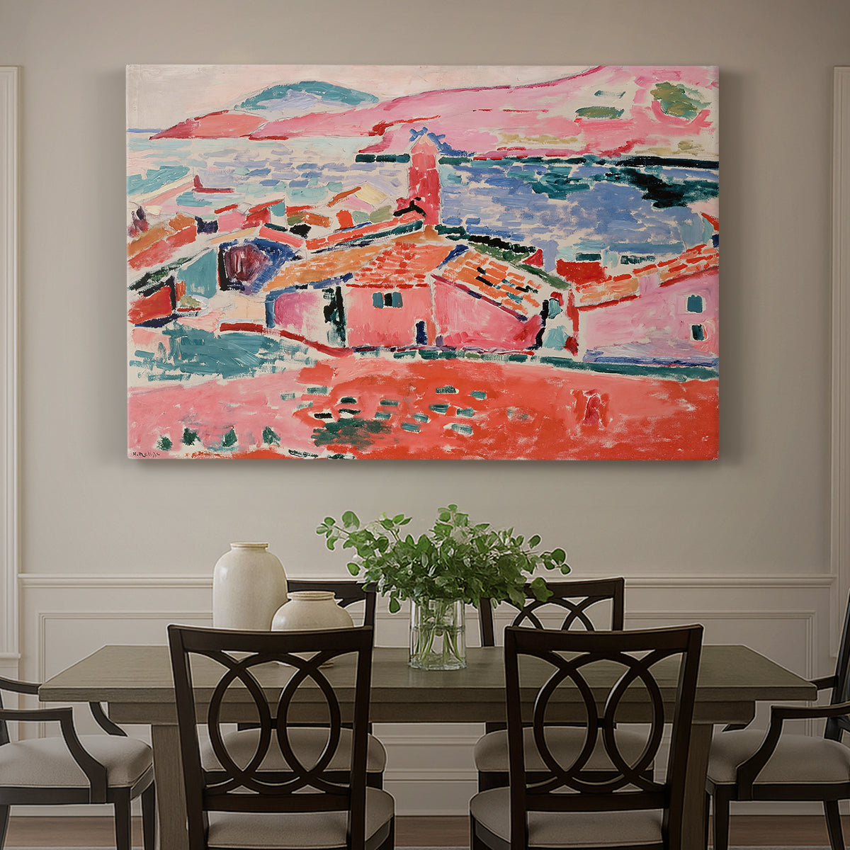 Canvas art print featuring a colorful coastal townscape with buildings, water, and bright rooftops, showcased as a statement wall artwork