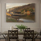 Canvas art print featuring a small harbor with boats docked along shoreline near buildings, showcased as a statement wall artwork
