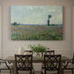 Canvas art print featuring a wide field of red poppies stretching across countryside under open sky, showcased as a statement wall artwork
