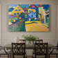 Canvas art print featuring a village street with colorful houses and trees lining a narrow road, showcased as a statement wall artwork
