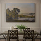 Canvas art print featuring a calm river winding through countryside with trees and open sky, showcased as a statement wall artwork