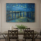 Canvas art print featuring a night scene with glowing stars reflected in river beside illuminated town, showcased as a statement wall artwork
