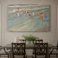 Canvas art print featuring children playing along shoreline with waves and wet sand, showcased as a statement wall artwork