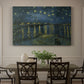Canvas art print featuring a night river scene with reflections of lights and stars across water, showcased as a statement wall artwork