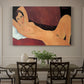 Canvas art print featuring a reclining nude woman stretched across a sofa with elongated form, showcased as a statement wall artwork