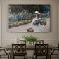 Canvas art print featuring a young girl seated in lush garden surrounded by blooming flowers, showcased as a statement wall artwork
