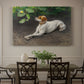 Canvas art print featuring a dog lying on ground with head raised in natural outdoor setting, showcased as a statement wall artwork