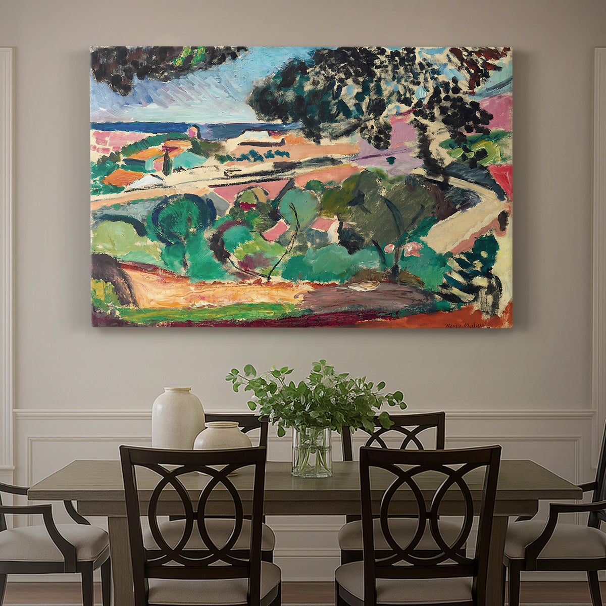 Canvas art print featuring a vivid landscape with hills, trees, and buildings near the coast, showcased as a statement wall artwork