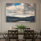 Canvas art print featuring a single boat floating on still lake surrounded by forested shoreline, showcased as a statement wall artwork