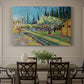Canvas art print featuring rows of flowering trees enclosed by tall cypress trees in orchard setting, showcased as a statement wall artwork