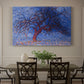 Canvas art print featuring a stylized red tree with branches against dark background, showcased as a statement wall artwork