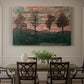 Canvas art print featuring four trees standing in open landscape against colorful sky, showcased as a statement wall artwork