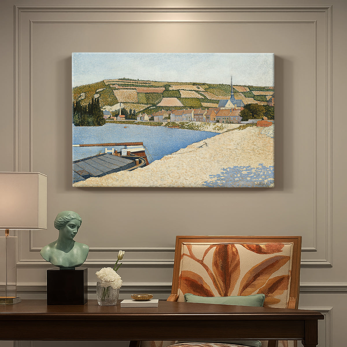 Canvas art print featuring a riverside with buildings and flowing water, presented within a refined interior setting