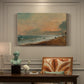 Canvas art print featuring a coastal shoreline with waves and open sky along beach, presented within a refined interior setting