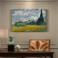 Canvas art print featuring a golden wheat field with tall cypress trees under swirling sky, presented within a refined interior setting