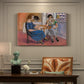 Canvas art print featuring two figures seated at a table playing dominoes in a colorful interior, presented within a refined interior setting