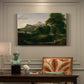 Canvas art print featuring a peaceful pastoral landscape with figures farming and grazing animals, presented within a refined interior setting