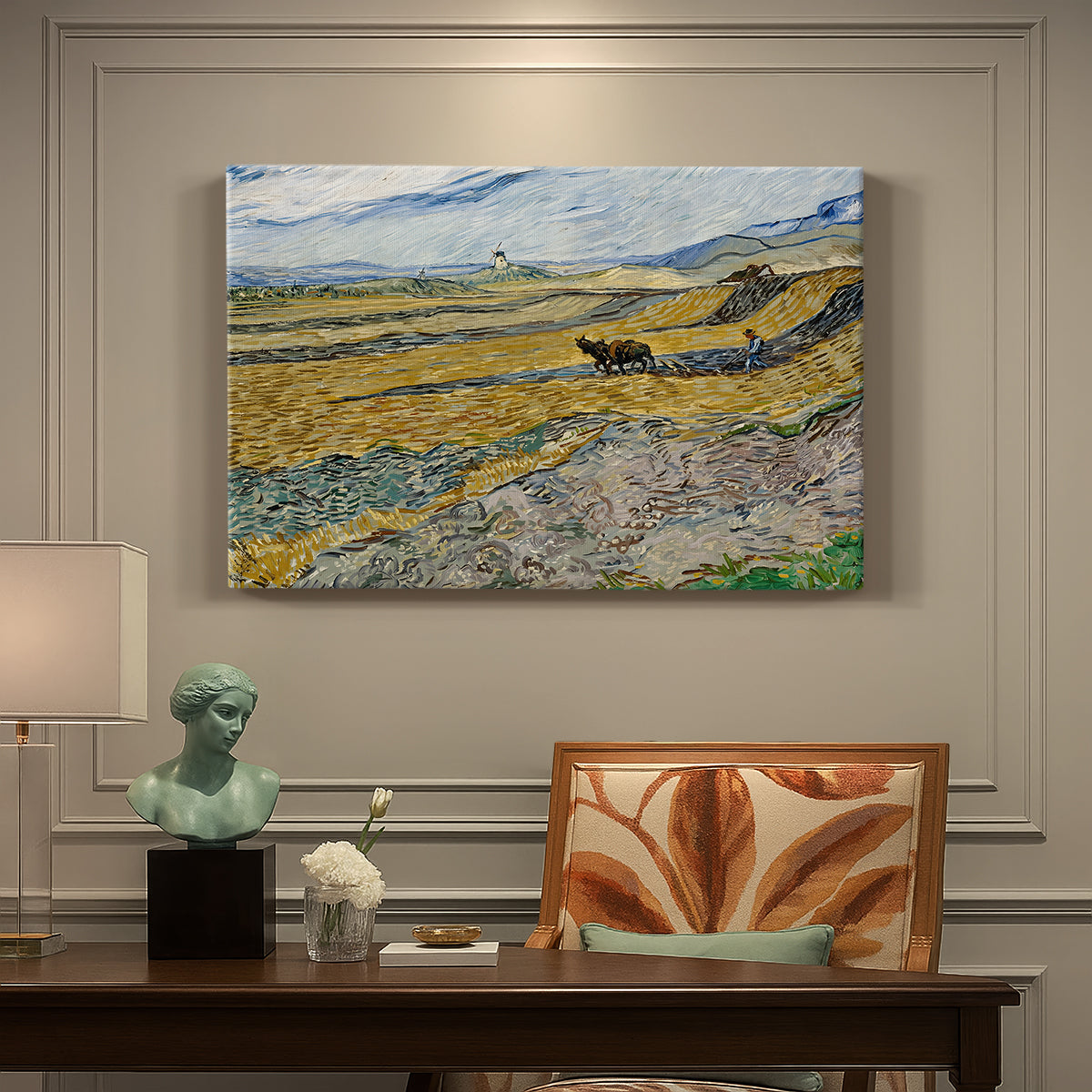 Canvas art print featuring a ploughed field enclosed by low walls with lone worker under broad sky, presented within a refined interior setting