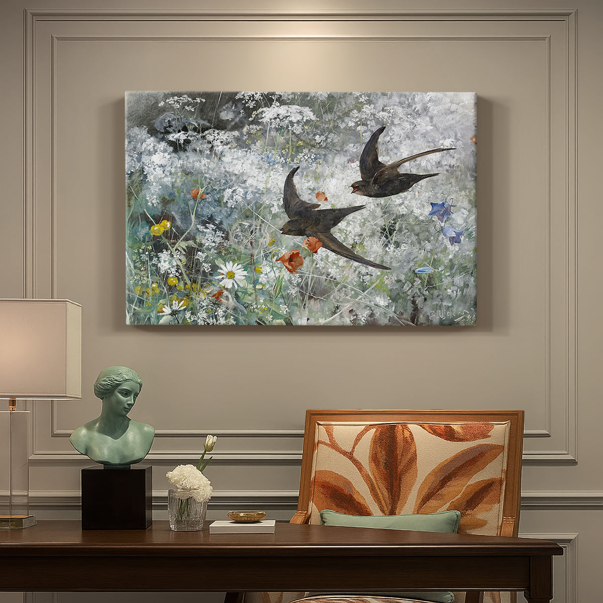 Canvas art print featuring a flock of birds in flight soaring across open sky above landscape, presented within a refined interior setting