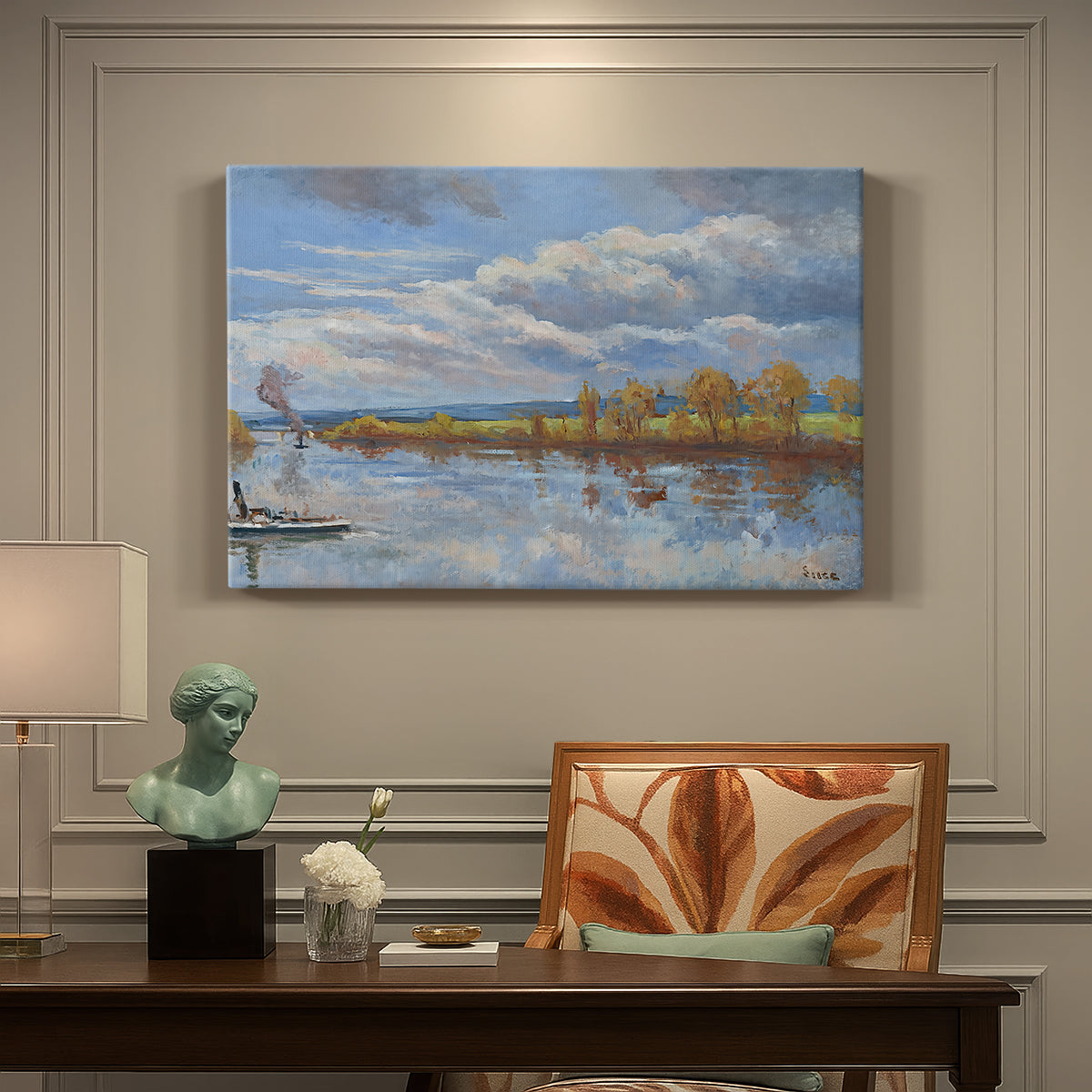 Canvas art print featuring a riverside landscape with water trees and distant structures, presented within a refined interior setting