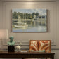 Canvas art print featuring a bridge spanning river with sailboats and reflections in water, presented within a refined interior setting