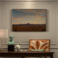 Canvas art print featuring a low mountain landscape under warm sky with broad open foreground, presented within a refined interior setting