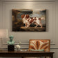 Canvas art print featuring a spaniel dog resting in landscape with attentive expression, presented within a refined interior setting
