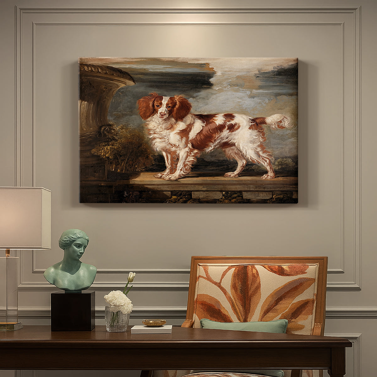 Canvas art print featuring a spaniel dog resting in landscape with attentive expression, presented within a refined interior setting