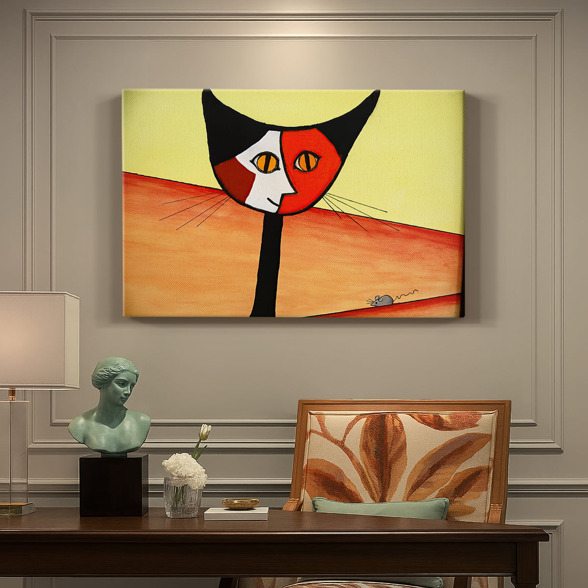 Canvas art print featuring a stylized cat face composed of bold geometric shapes, presented within a refined interior setting