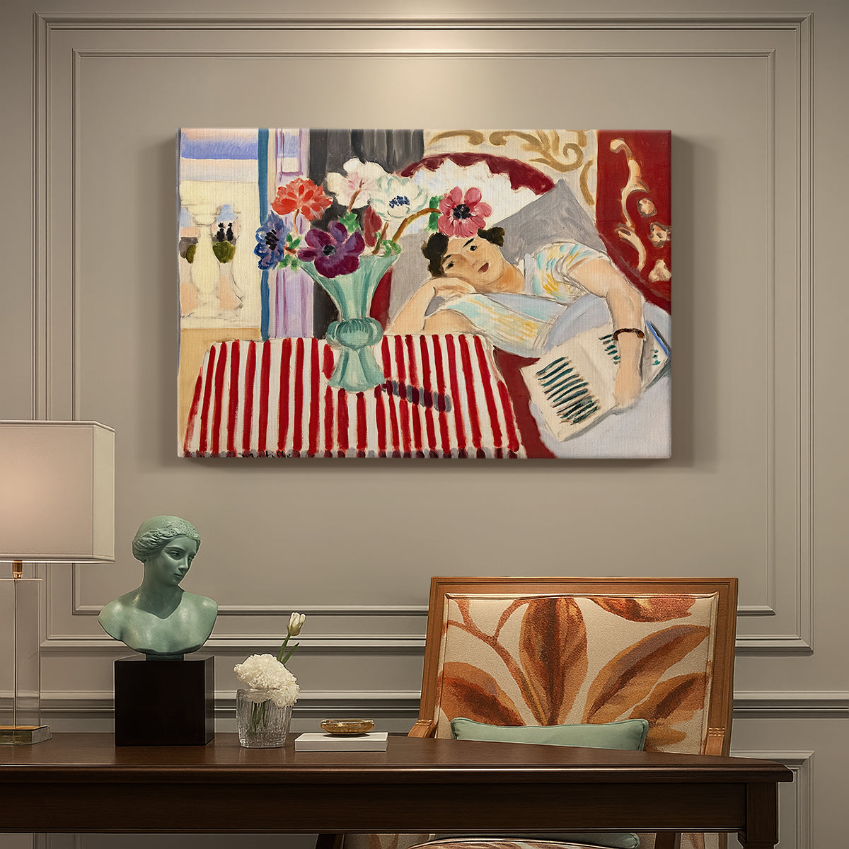 Canvas art print featuring a seated woman beside vase of anemones in richly patterned interior, presented within a refined interior setting