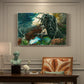 Canvas art print featuring a figure seated near fire in forest clearing surrounded by trees, presented within a refined interior setting
