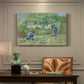 Canvas art print featuring a rural family scene with child taking first steps between adults outdoors, presented within a refined interior setting