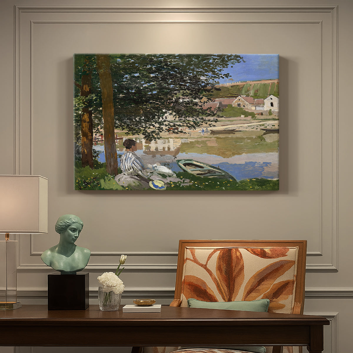 Canvas art print featuring a woman and child seated along riverbank beneath trees in soft daylight, presented within a refined interior setting