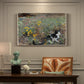 Canvas art print featuring a cat crouching in a meadow filled with wildflowers and greenery, presented within a refined interior setting