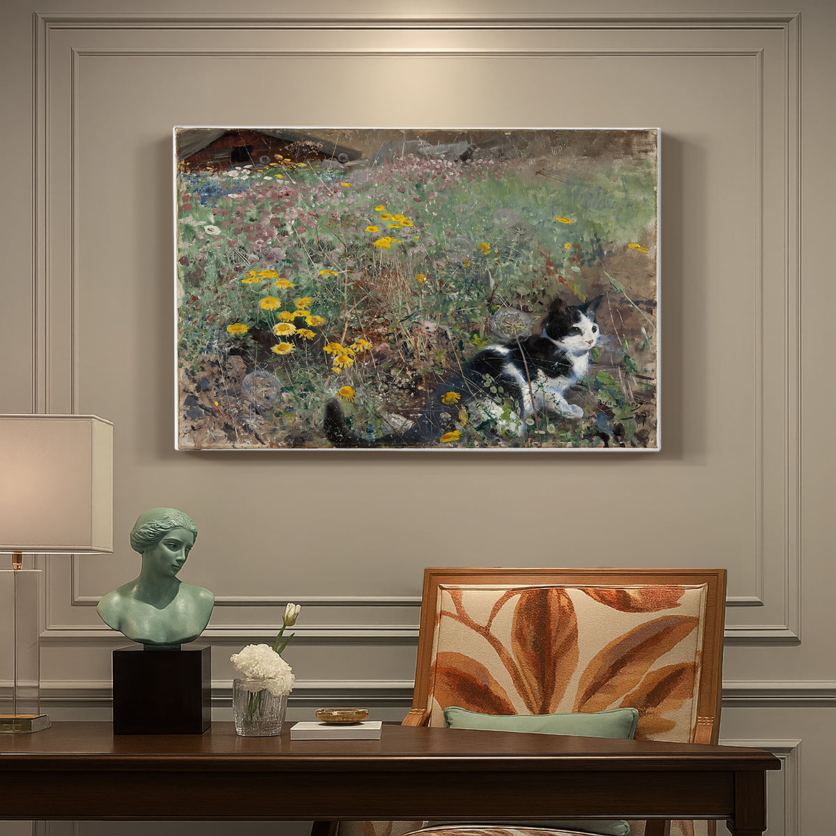 Canvas art print featuring a cat crouching in a meadow filled with wildflowers and greenery, presented within a refined interior setting