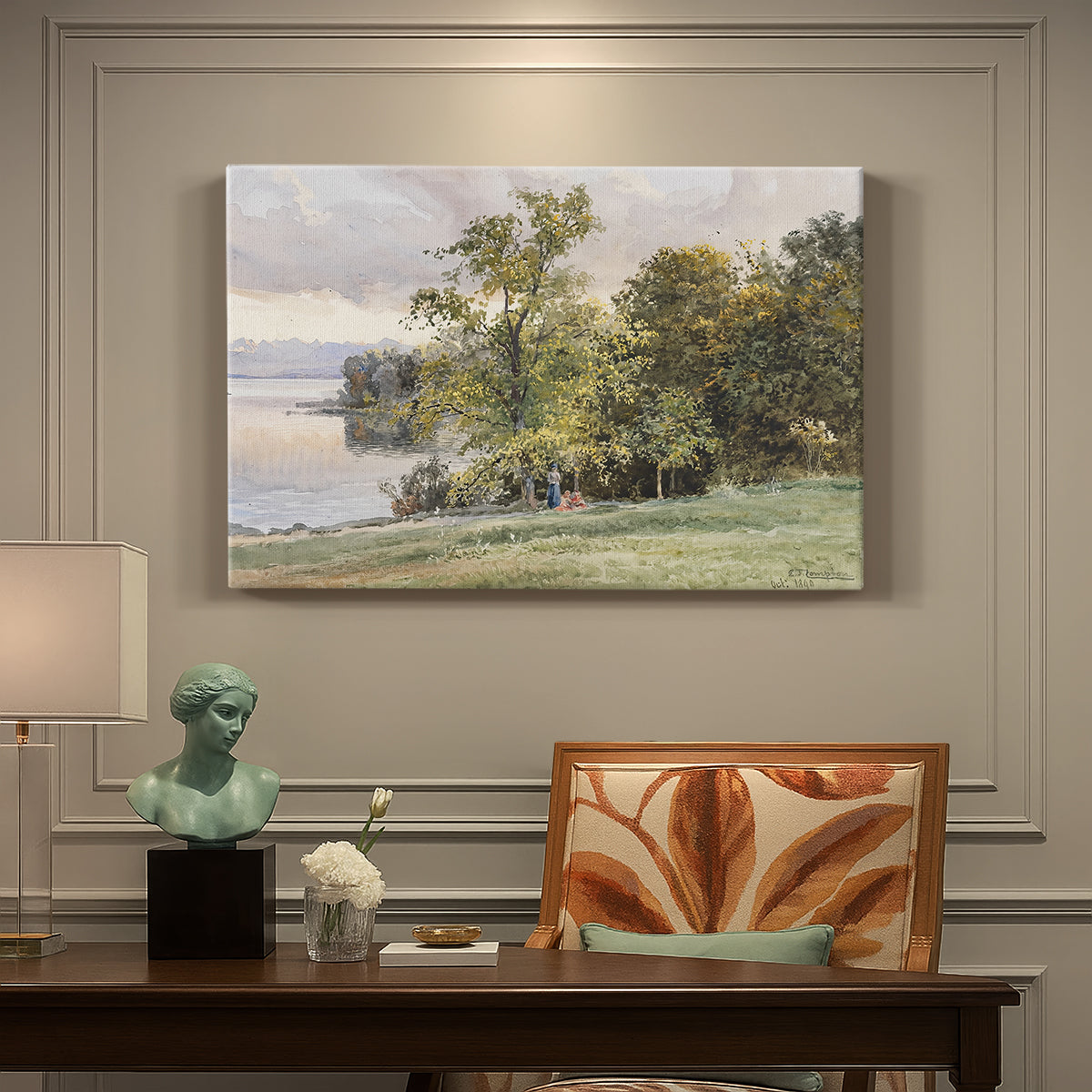 Canvas art print featuring a lakeside landscape with calm water and trees along shoreline, presented within a refined interior setting