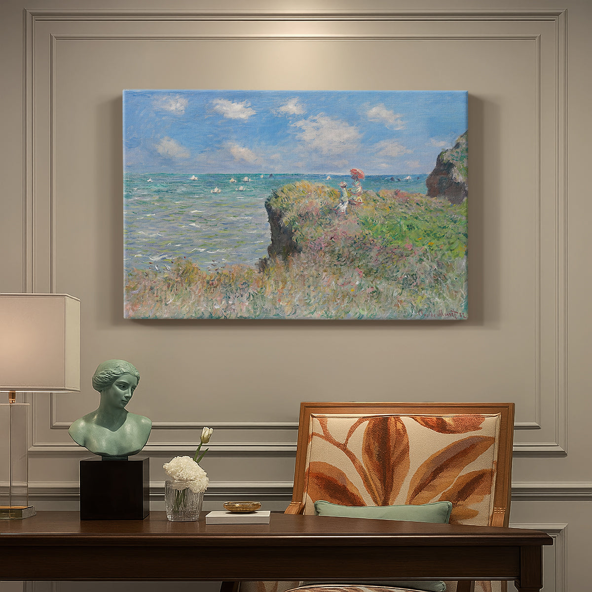 Canvas art print featuring figures walking along coastal cliff path overlooking ocean and sky, presented within a refined interior setting